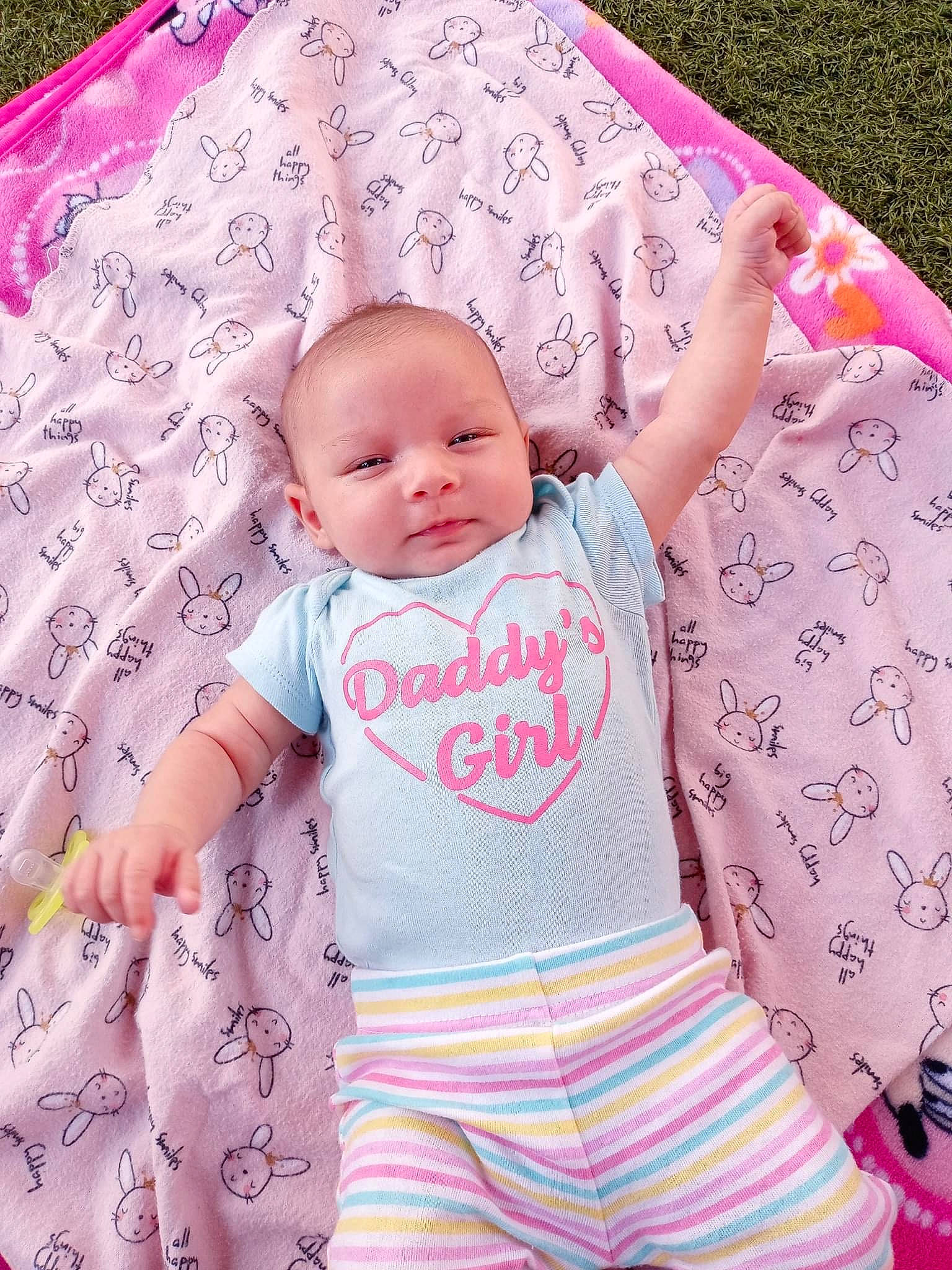 Luna Bella is registered to the contest to win money with this photo: arm, baby, baby_toddler_clothing, cheek, comfort, eye, face, facial_expression, finger, green, hand, happy, head, person, pink, skin, sleeve, t_shirt, textile, toddler