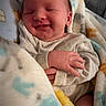 Kayson joined the competition — help win amazing prizes! newborn, baby, smiling, blanket, cozy, sleeping, infant, cute, soft, wrapped, child, peaceful, warm, portrait, hands, clothing, indoors, comfort, resting, happy