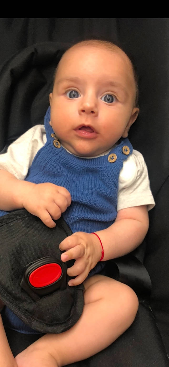 Aris is registered to the contest to win money with this photo: baby, baby_carriage, baby_products, car_seat, cheek, child, child_model, lip, person, product, sitting, skin, surprise, toddler