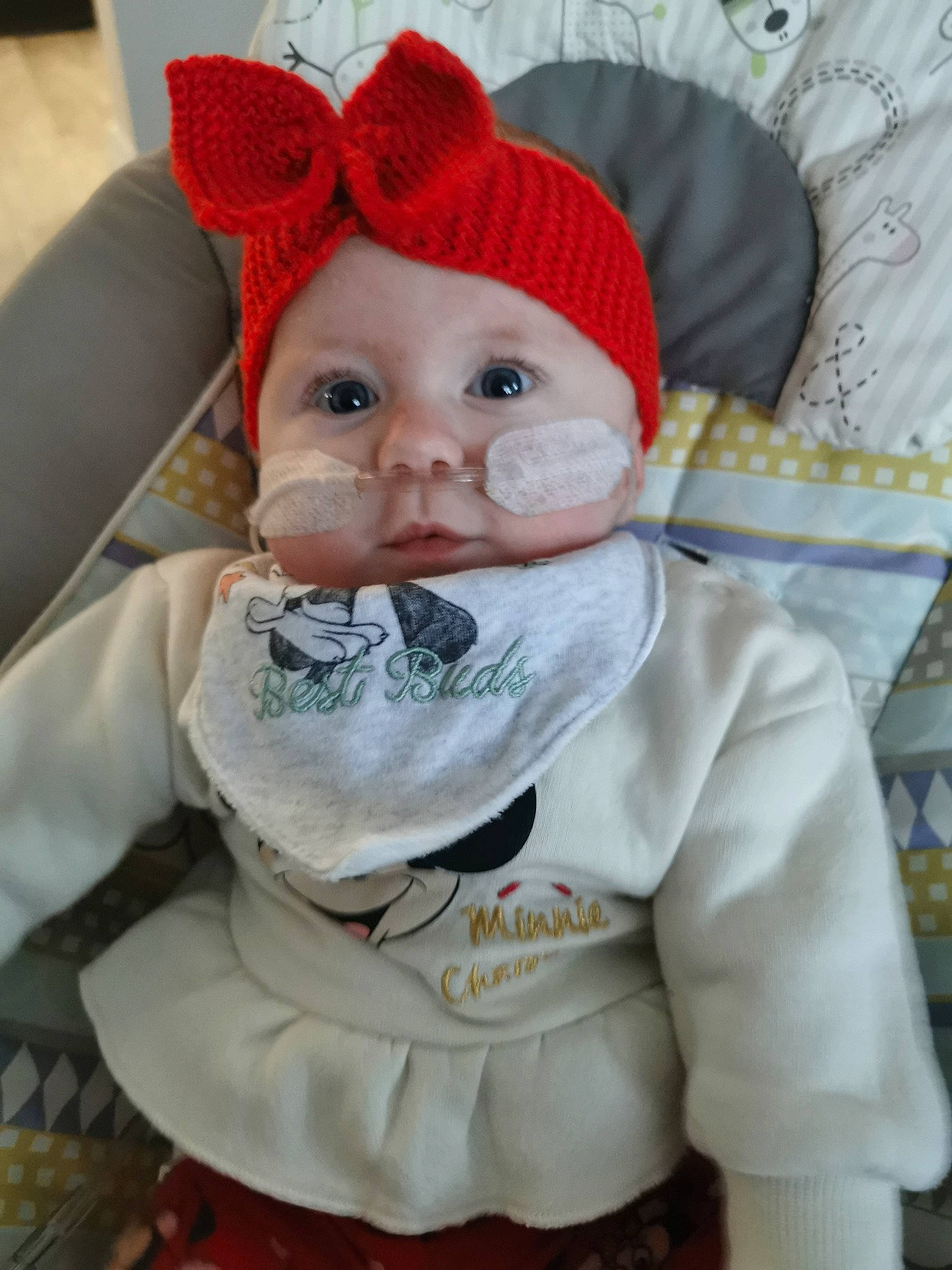 Holly is registered to the contest to win money with this photo: baby, baby_products, baby_toddler_clothing, cap, cheek, child, costume_hat, eye, face, fictional_character, head, headwear, human_body, iris, knit_cap, linens, lip, mouth, nose, person