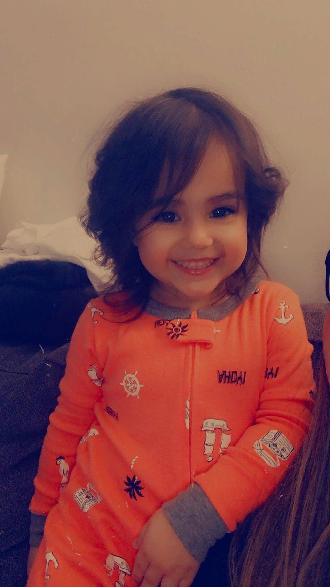 Carmen is registered to the contest to win money with this photo: arm, bangs, cheek, child, fun, gesture, hand, happy, human_body, jewellery, joy, lip, long_hair, neck, nose, person, sitting, skin, sleeve, smile