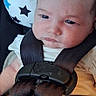 Madison is registered to the contest to win money with this photo: baby, infant, child, car_seat, harness, buckled, sitting, portrait, face, eyes, looking_at_camera, serious, indoor, star_pattern, cushion, clothing,  안전, close_up, photography, transportation