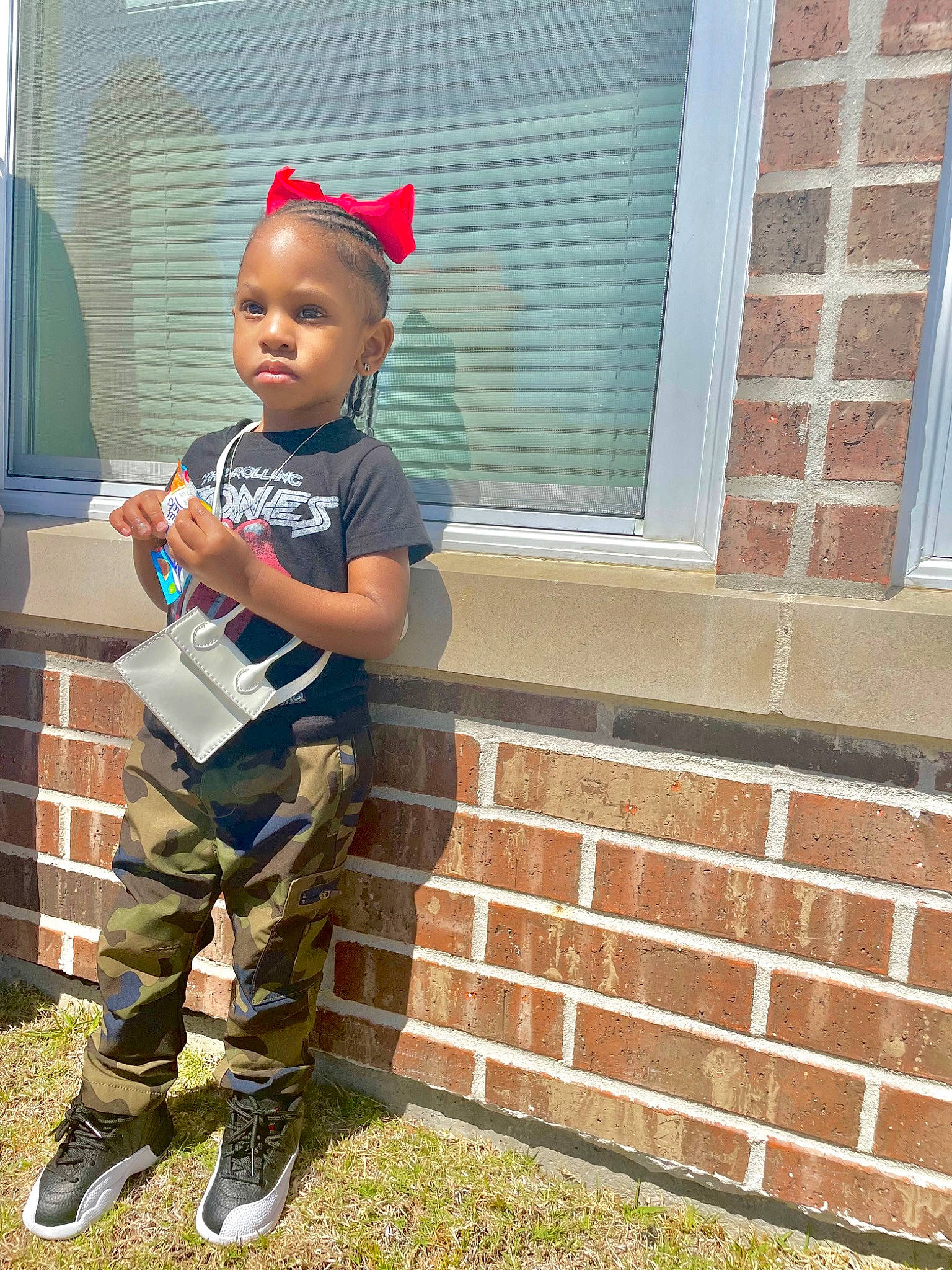Haidyn is registered to the contest to win money with this photo: brick, brickwork, cap, child, fun, grass, happy, hat, home, house, knee, leisure, military_camouflage, person, play, shorts, soil, t_shirt, toddler, walking_shoe