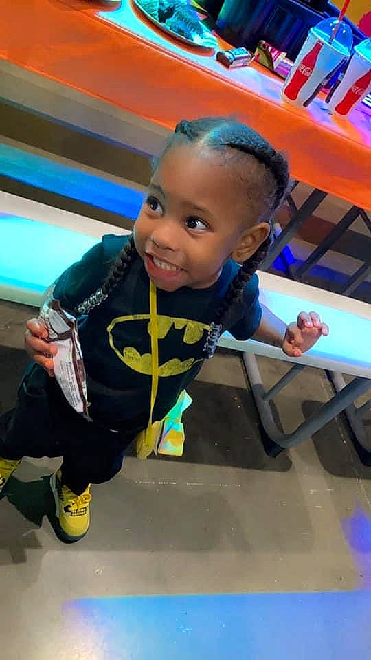 Haidyn is registered to the contest to win money with this photo: chair, child, electric_blue, flooring, fun, games, happy, indoor_games_and_sports, joy, leisure, outdoor_play_equipment, person, personal_protective_equipment, play, recreation, room, sitting, smile, standing, t_shirt