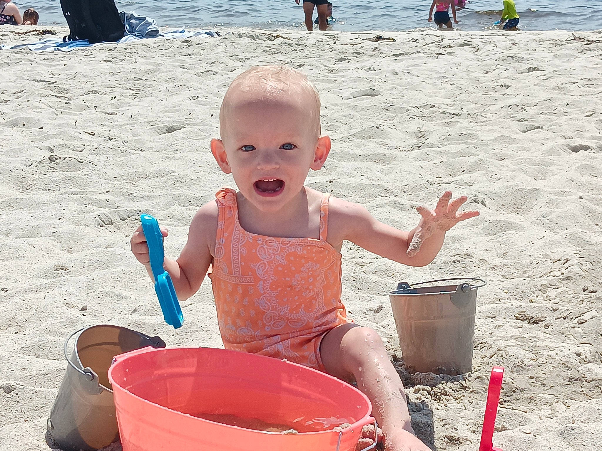 Amaya is registered to the contest to win money with this photo: baby, beach, body_of_water, bucket, child, fun, happy, holiday, leisure, people, people_on_beach, person, photograph, sand, shorts, snapshot, summer, toddler, travel, vacation