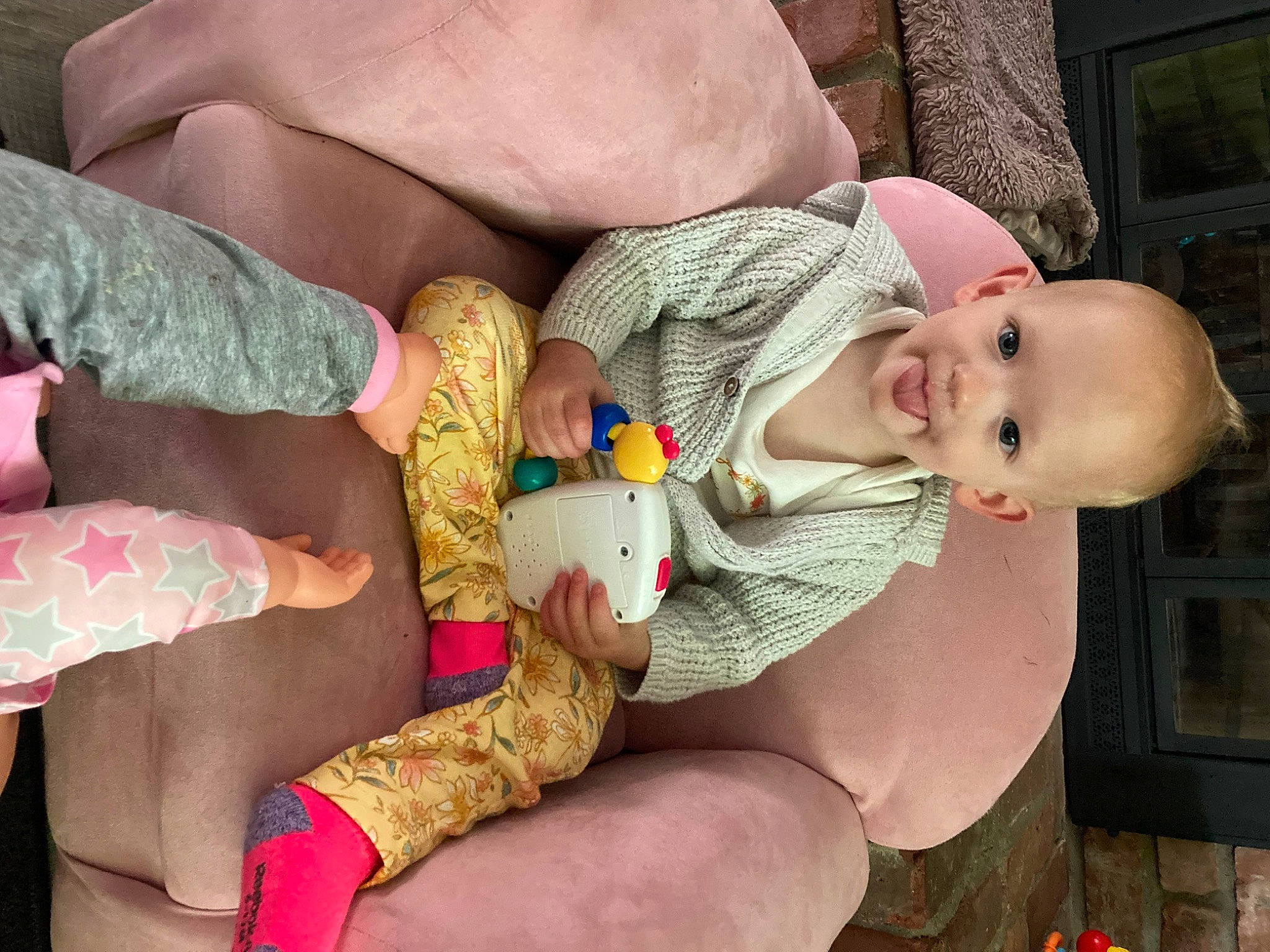 Amaya is registered to the contest to win money with this photo: baby, baby_toddler_clothing, cheek, child, comfort, finger, hand, human, joint, leg, mouth, person, pink, product, skin, smile, textile, thigh, toddler, trunk