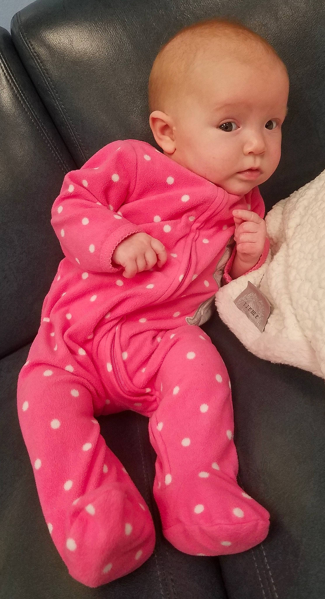 Cass is registered to the contest to win money with this photo: baby, baby_toddler_clothing, cheek, child, design, lip, pajamas, pattern, person, pink, sitting, skin, sleeve, smile, toddler