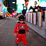 child, toddler, street, night, urban, fashion, red_clothing, jordan, sunglasses, durag, sneakers, walking, sidewalk, lights, neon, city, casual, cool, portrait, outdoor