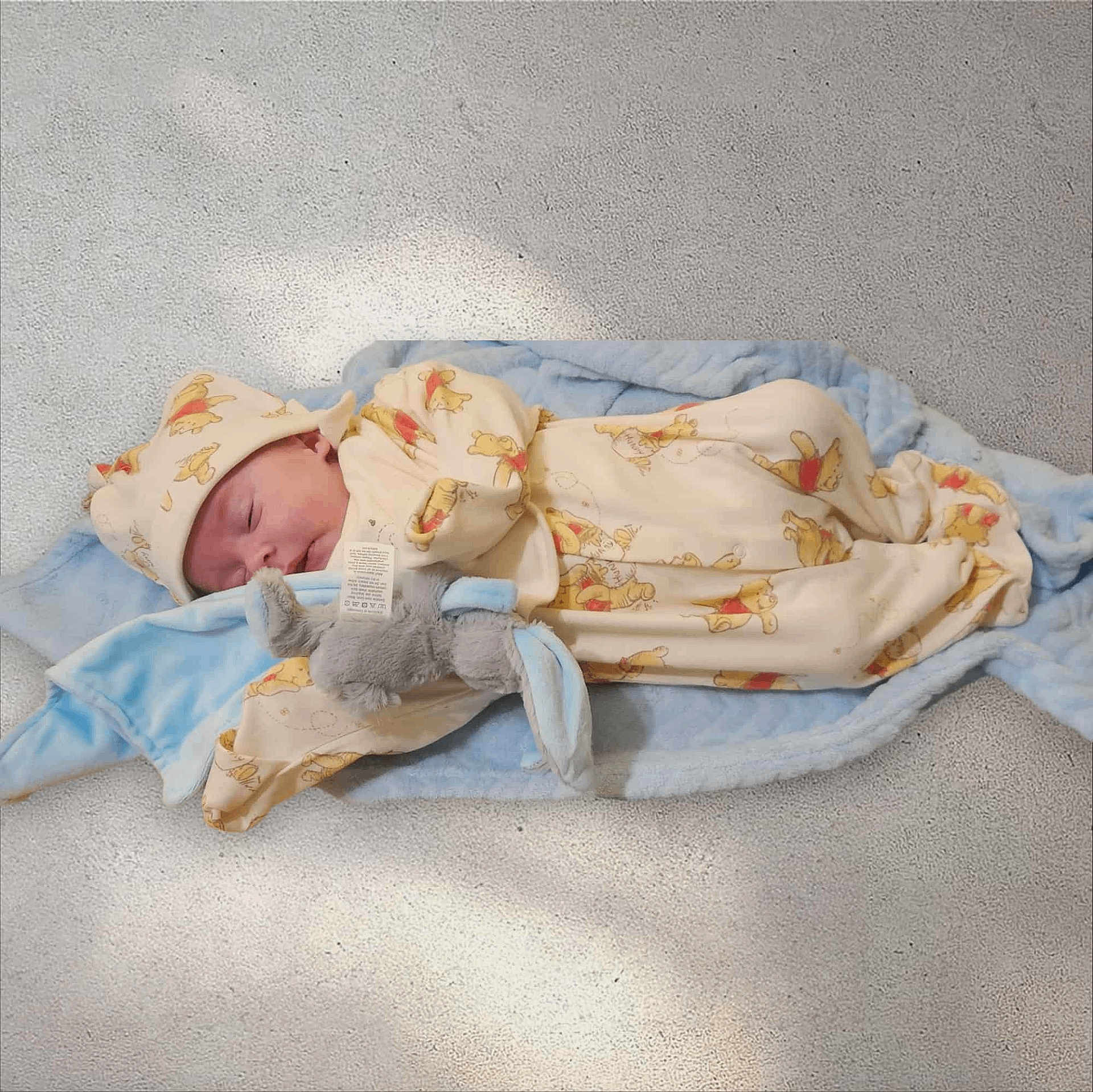 R.j joined the competition — help win amazing prizes! baby, newborn, sleeping, blanket, plush_toy, soft, cozy, hat, infant, cute, child, resting, indoors, fabric, comfort, peaceful, wearing, person, lying_down, wrapped