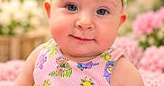 Lena is registered to the contest to win money with this photo: baby, child, infant, portrait, smiling, pink, bow, headband, dress, tutu, floral, flowers, garden, pastel, cute, sitting, close_up, face, outdoor, photography