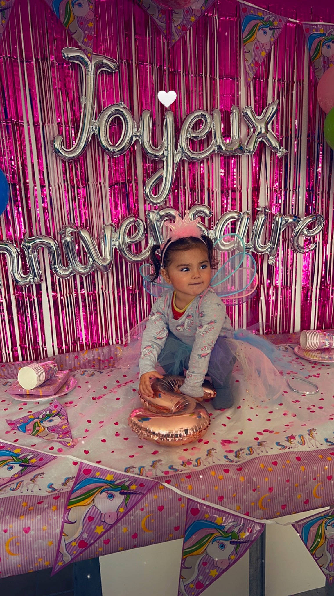 Vayana participe au concours pour gagner de l'argent avec cette photo : book_cover, child, event, flooring, font, happy, hat, icing, leisure, magenta, pattern, person, petal, photo_caption, purple, sitting, textile, toddler, violet