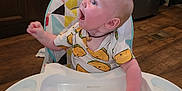 Axton joined the competition — help win amazing prizes! baby, high_chair, party_hat, watermelon, taco_shirt, kitchen, wood_floor, stainless_steel_appliance, food, fruit, child, happy, celebration, cute, infant, smiling, meal, tableware, indoor, person