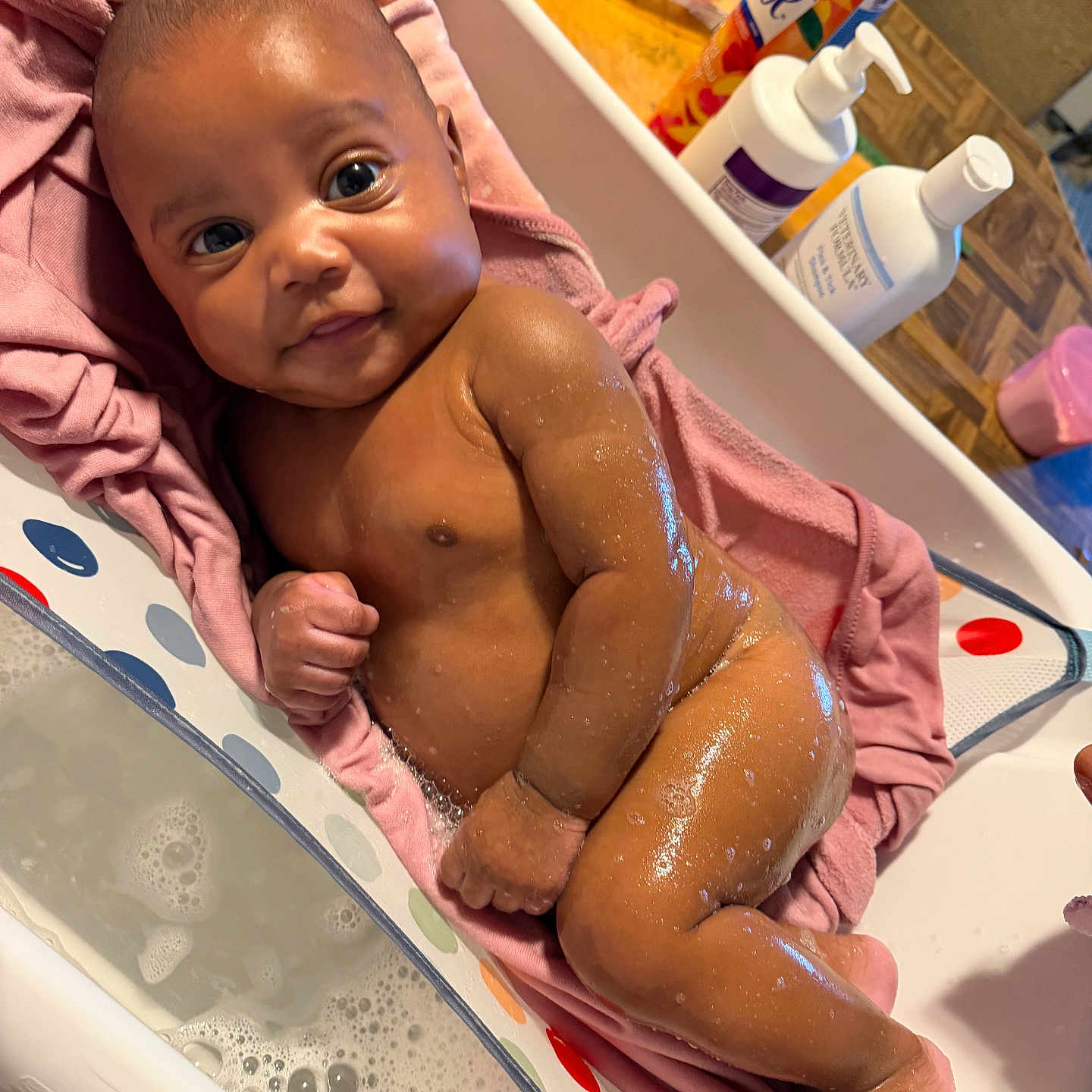 Aalaya is registered to the contest to win money with this photo: baby, infant, bath, towel, skin, water, soap, lotion, bathtub, pink, happy, smiling, wet, cute, child, person, indoor, bathroom, clean, relaxing