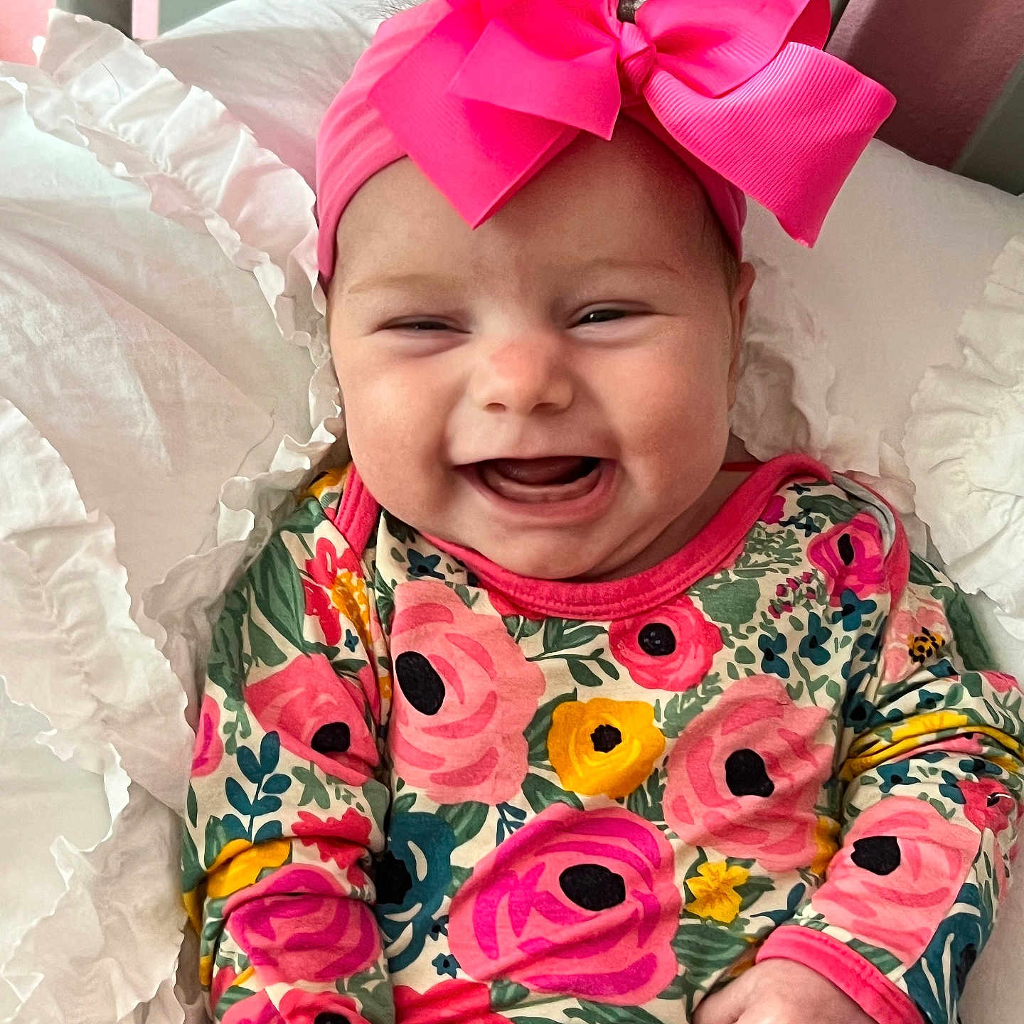 Harlee joined the competition — help win amazing prizes! baby, babylaughing, bed, clothing, cushion, face, flower, furniture, happy, head, homedecor, laughing, pajamas, person, photography, plant, portrait, quilt, rose, smile