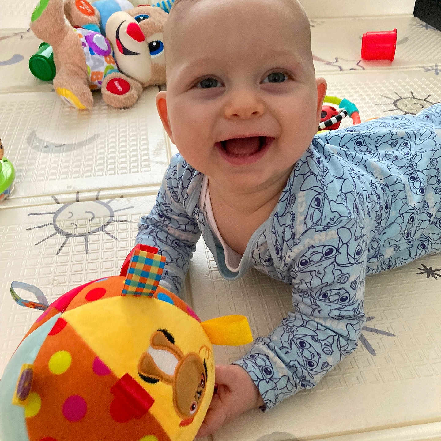 Brodie is registered to the contest to win money with this photo: baby, babycrawling, babylaughing, crawling, face, happy, head, person, photography, plush, portrait, smile, toy