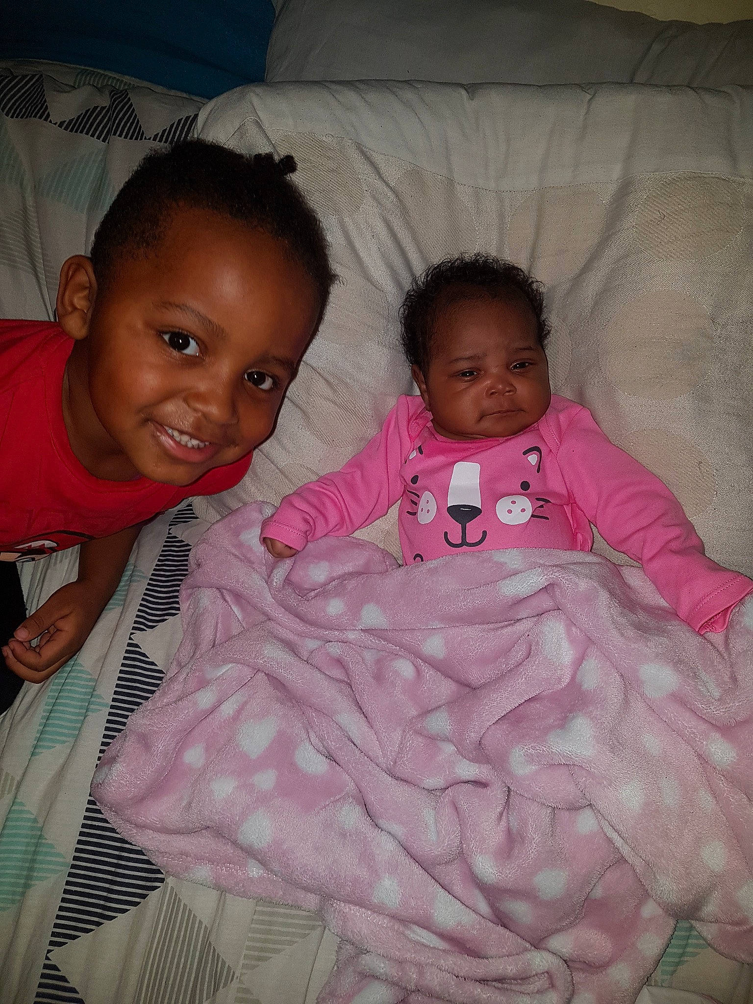 Cassius joined the competition — help win amazing prizes! baby, bed, bedtime, cheek, child, fun, joy, magenta, person, pink, sibling, skin, smile, textile, toddler