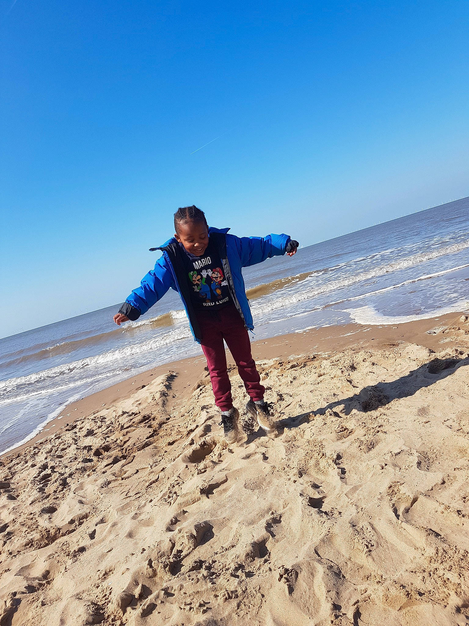 Cassius joined the competition — help win amazing prizes! beach, cloud, coast, coastal_and_oceanic_landforms, fun, horizon, joy, mountain, natural_environment, ocean, outerwear, person, recreation, sand, sea, shore, sky, summer, tourism, vacation