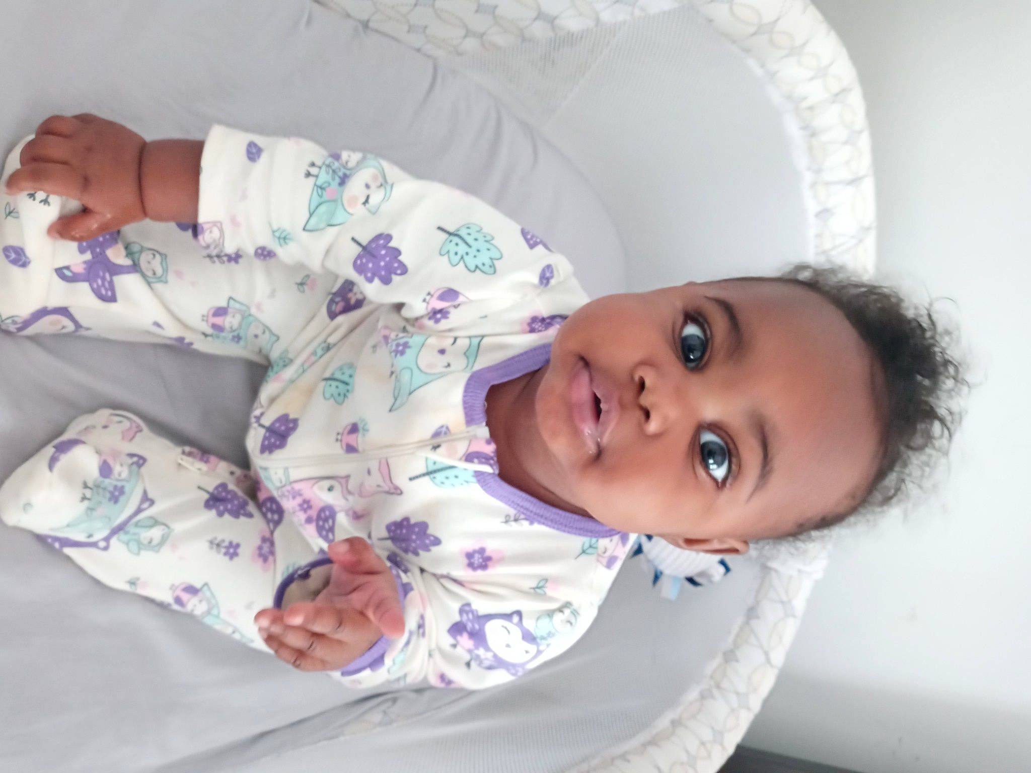 Empress is registered to the contest to win money with this photo: baby, baby_toddler_clothing, cheek, child, comfort, eyelash, happy, human_body, linens, lip, nose, outerwear, pattern, person, product, purple, skin, sleeve, textile, toddler