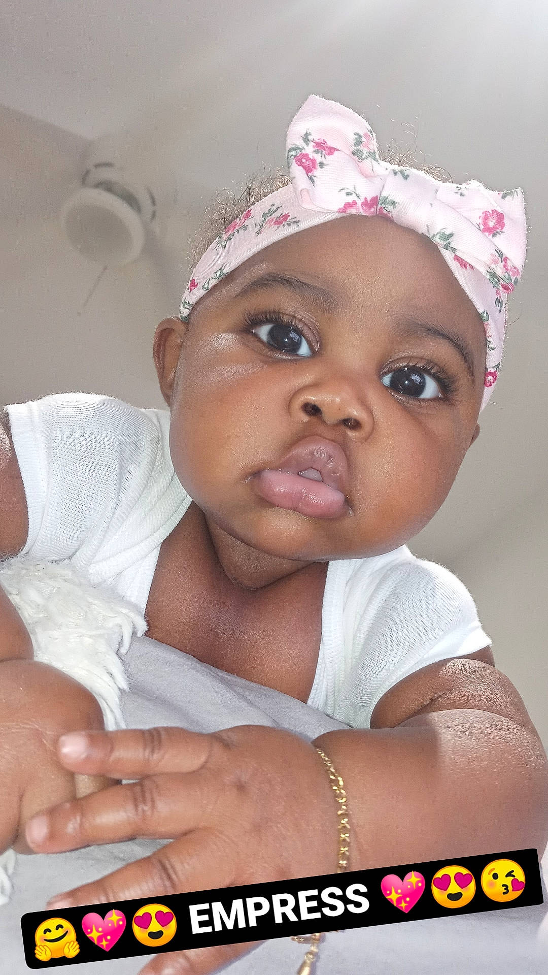 Empress is registered to the contest to win money with this photo: baby, baby_toddler_clothing, cap, cheek, chin, eye, eyebrow, eyelash, facial_expression, happy, headwear, iris, lip, mouth, nose, organ, person, pink, skin, smile