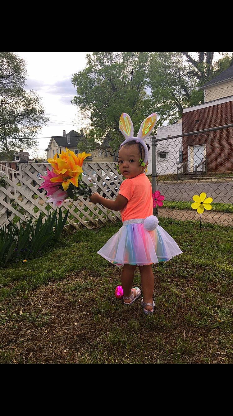 Kaelani joined the competition — help win amazing prizes! automotive_wheel_system, child, costume, dress, flower, garden, happy, person, petal, pink, pinwheel, plant, spring, toddler, wheel, wildflower, yard, yellow