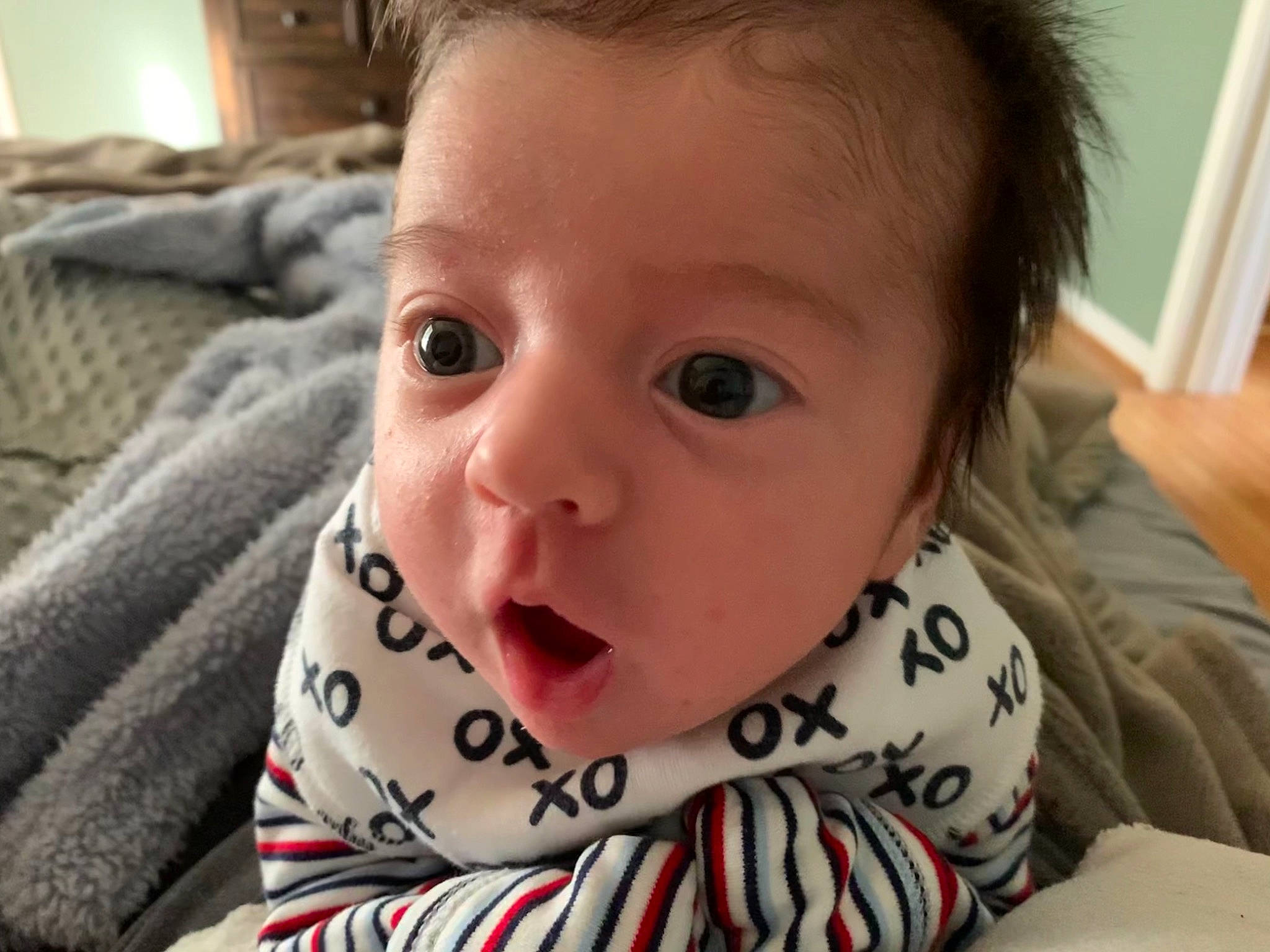 Jonathon is registered to the contest to win money with this photo: baby, baby_toddler_clothing, cheek, comfort, ear, eyebrow, eyelash, face, facial_expression, forehead, iris, jaw, lip, mouth, neck, nose, people, person, skin, sleeve