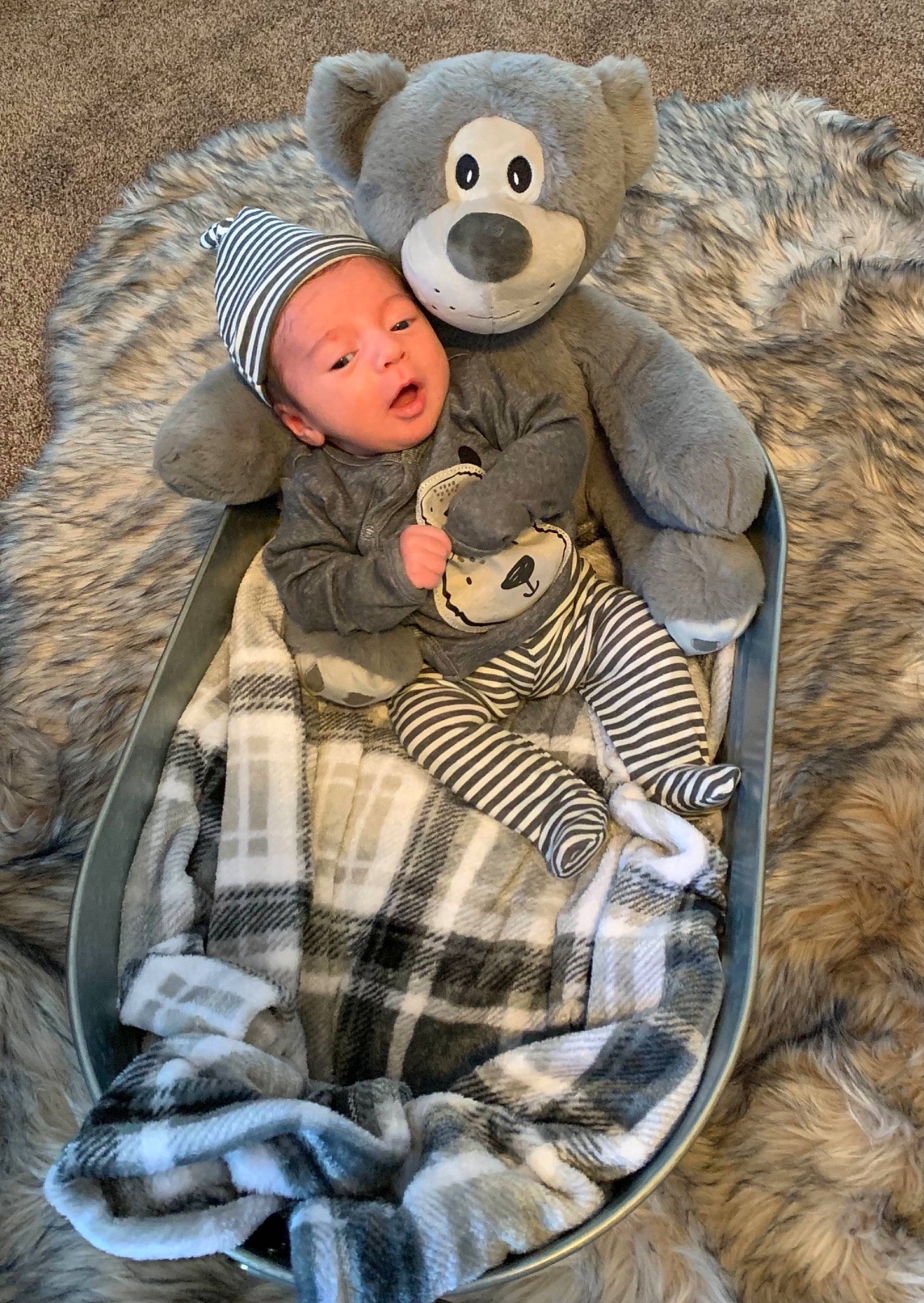 Jonathon is registered to the contest to win money with this photo: baby, baby_products, baby_toddler_clothing, child, comfort, fawn, fur, hat, head, headgear, headwear, mammal, person, plush, product, stuffed_toy, teddy_bear, textile, toddler, toy