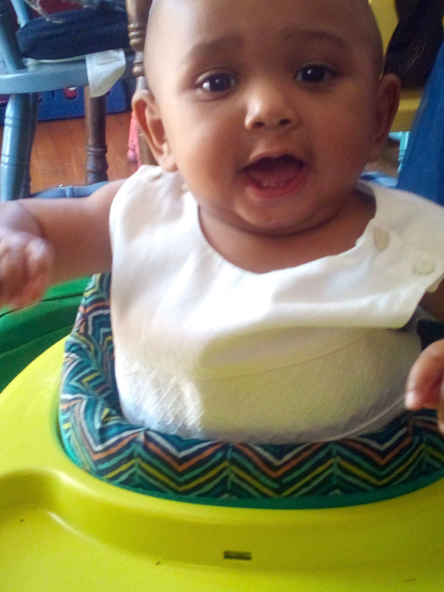 Memphis is registered to the contest to win money with this photo: baby, baby_food, cheek, child, chin, eating, face, facial_expression, forehead, fun, head, mouth, neck, nose, person, play, sitting, skin, smile, toddler