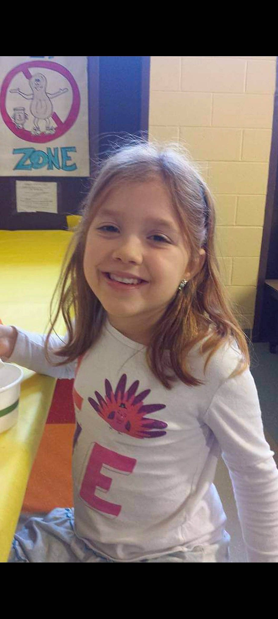 Myah is registered to the contest to win money with this photo: blond, cheek, child, coffee_cup, cup, eyebrow, fun, hair, hairstyle, happy, head, iris, joy, long_hair, organ, person, serveware, skin, sleeve, smile