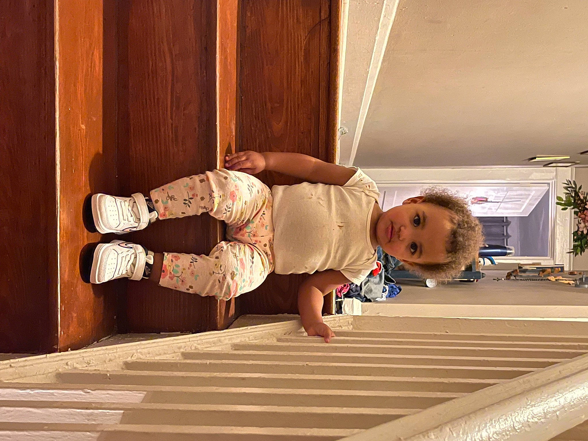 Kamiyah is registered to the contest to win money with this photo: baby, baby_toddler_clothing, floor, flooring, hardwood, houseplant, human_leg, interior_design, knee, laminate_flooring, leg, leisure, person, plant, shoe, sneakers, thigh, toddler, varnish, wood