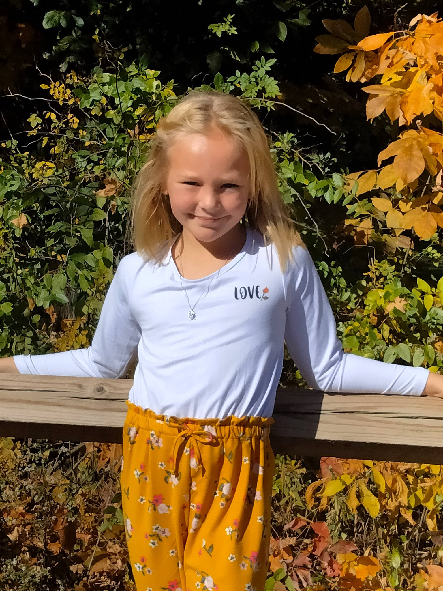 Roxie is registered to the contest to win money with this photo: blond, botany, child, fun, garden, grass, happy, joy, leisure, pattern, people_in_nature, person, plant, pumpkin, sleeve, smile, soil, t_shirt, toddler, tree