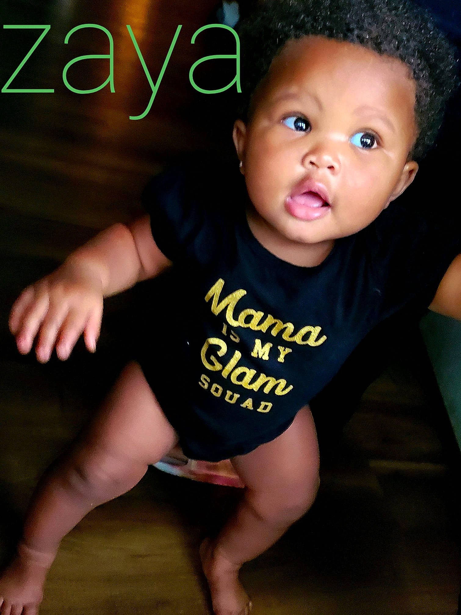 Zaya is registered to the contest to win money with this photo: baby, baby_toddler_clothing, black_hair, cheek, child, cool, eye, fun, hand, happy, head, lip, person, photo_caption, photography, product, sitting, skin, smile, surprise