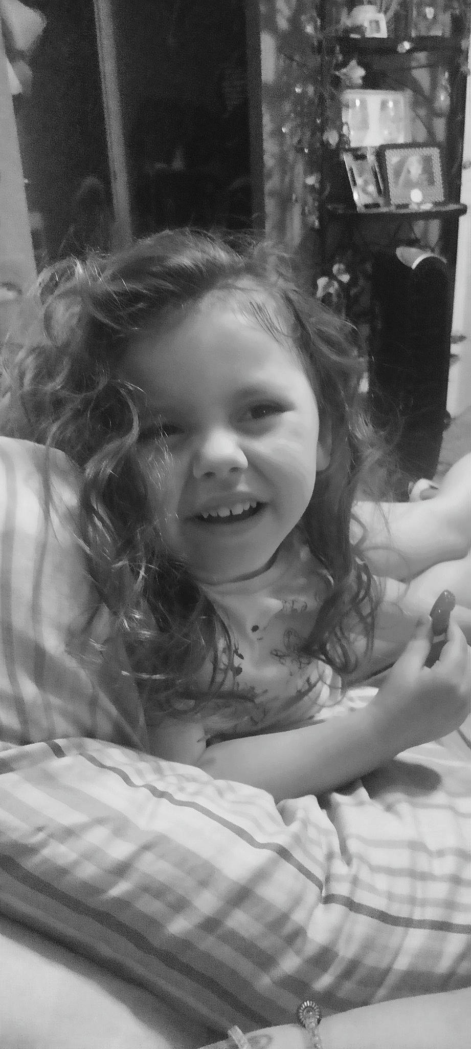 Promise is registered to the contest to win money with this photo: arm, black, black_and_white, dress, eyebrow, face, facial_expression, flash_photography, gesture, hand, happy, human, iris, joy, mammal, organ, person, skin, smile, standing