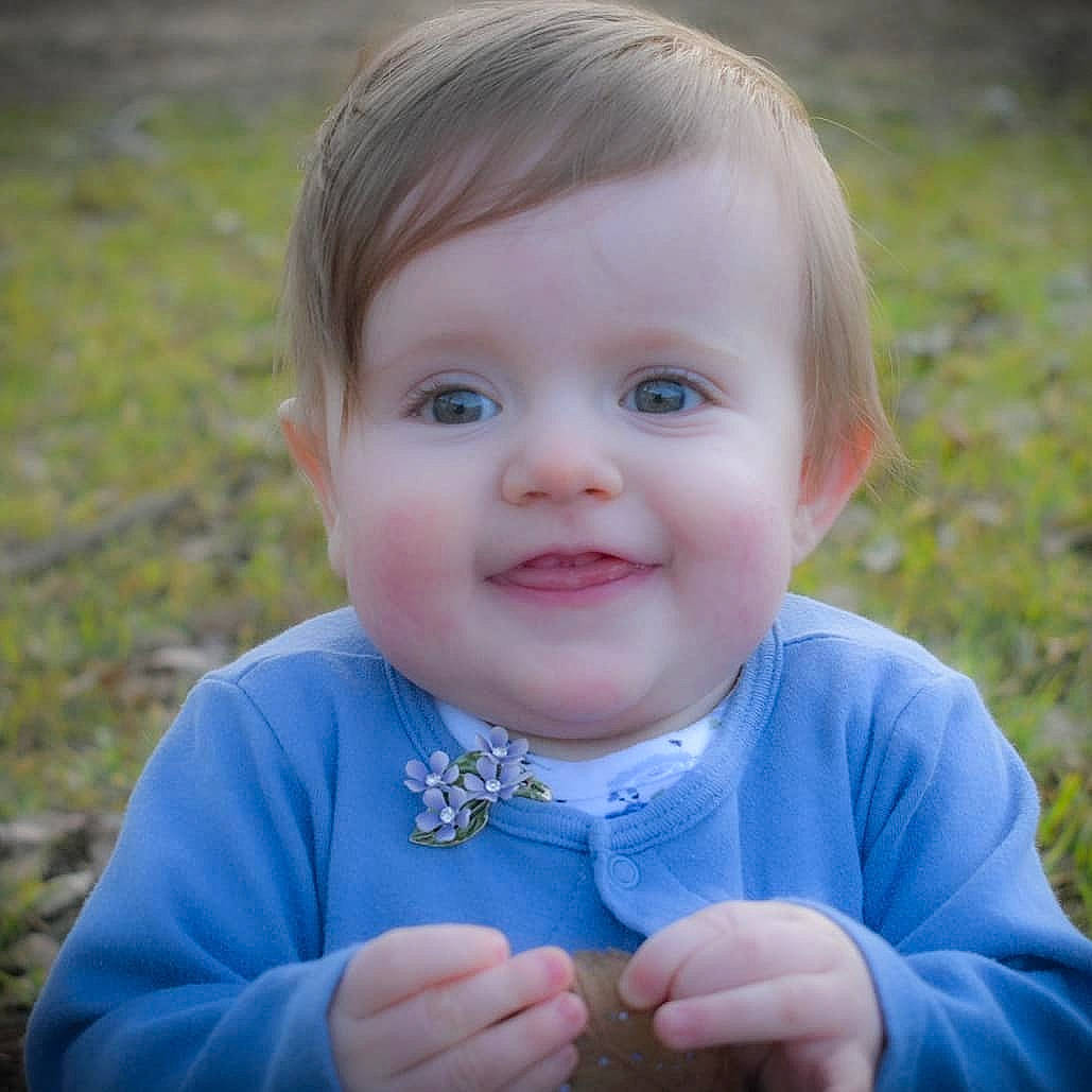 Adelynn joined the competition — help win amazing prizes! baby, blond, cheek, child, eye, face, facial_expression, grass, happy, head, iris, lip, person, photography, plant, portrait, portrait_photography, skin, smile, toddler