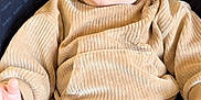 Raoul participe au concours pour gagner de l'argent avec cette photo : baby, child, sunglasses, beige_clothing, ribbed_fabric, infant, babybjorn, seat, relaxed, cute, portrait, indoor, fashion, comfort, young_child, face, hand, cozy, casual, wearing