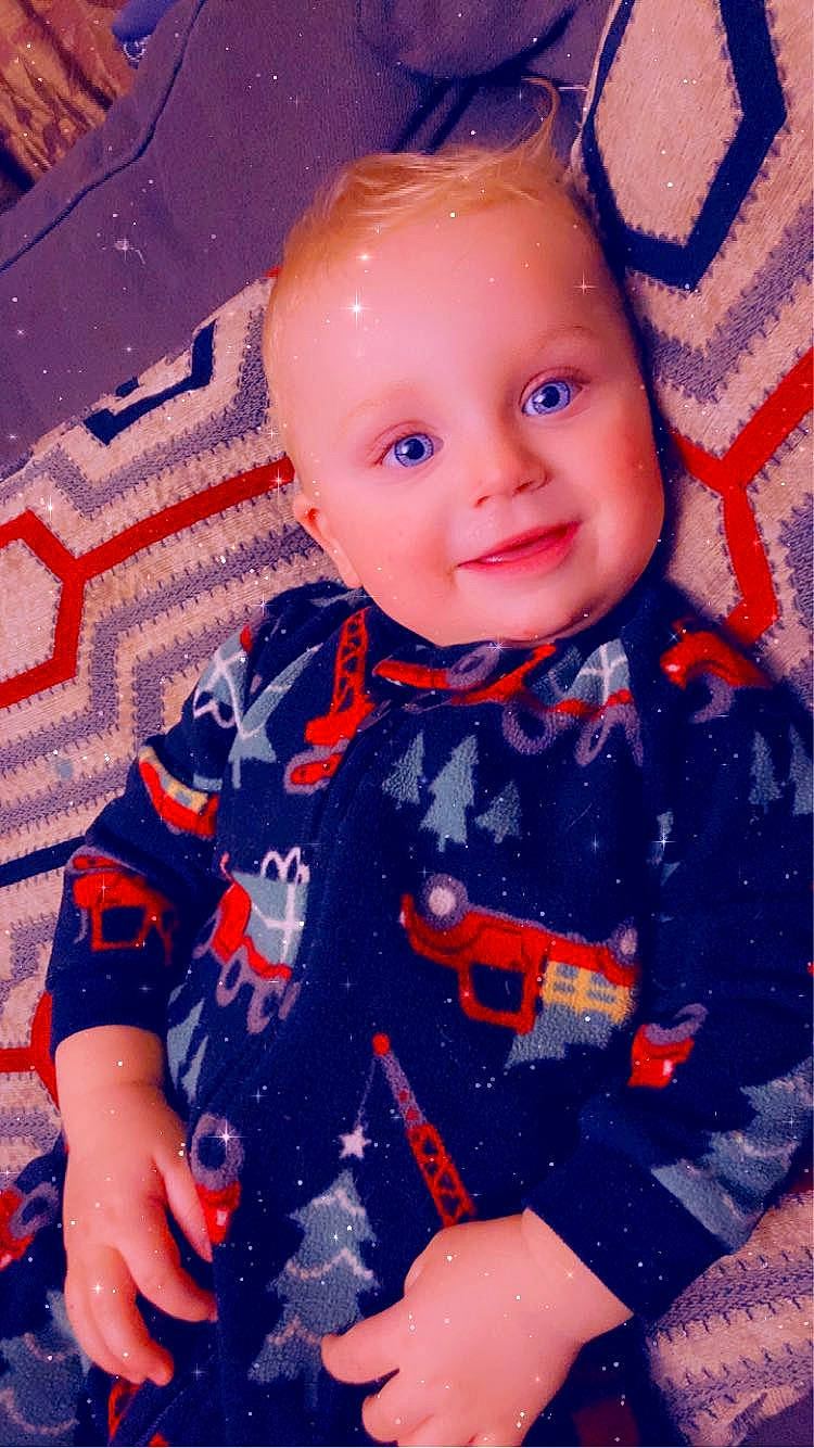 Oakley is registered to the contest to win money with this photo: azure, baby, baby_toddler_clothing, cheek, child, collar, cool, electric_blue, fun, happy, iris, joy, magenta, nose, pattern, person, pink, sleeve, smile, standing