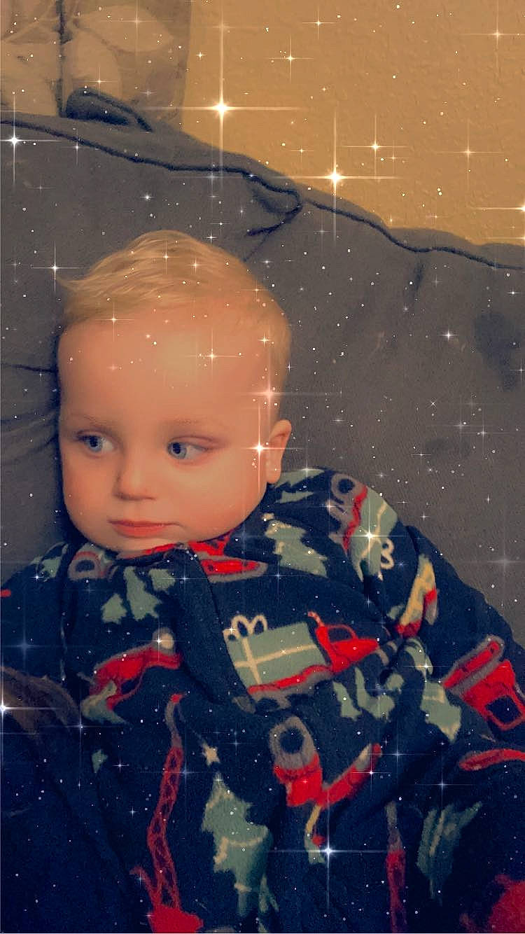 Oakley is registered to the contest to win money with this photo: art, astronomical_object, baby_toddler_clothing, carmine, cheek, child, doll, fun, illustration, pattern, person, sleeve, snow, space, toddler, toy, vintage_clothing, visual_arts, window, winter