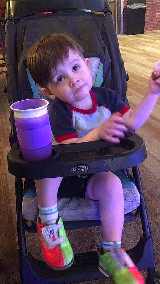 Silas joined the competition — help win amazing prizes! baby_toddler_clothing, chair, child, comfort, electric_blue, fun, human_leg, lap, leg, leisure, magenta, person, product, purple, room, sitting, skin, snapshot, sock, toddler