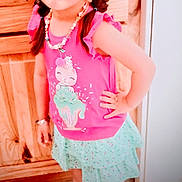 Anabella joined the competition — help win amazing prizes! child, girl, sunglasses, braids, pink_top, mint_green_skirt, necklace, indoor, wooden_furniture, smile, posing, footwear, beaded_accessory, hair_ties, fashion, cute, playful, person, floor, standing