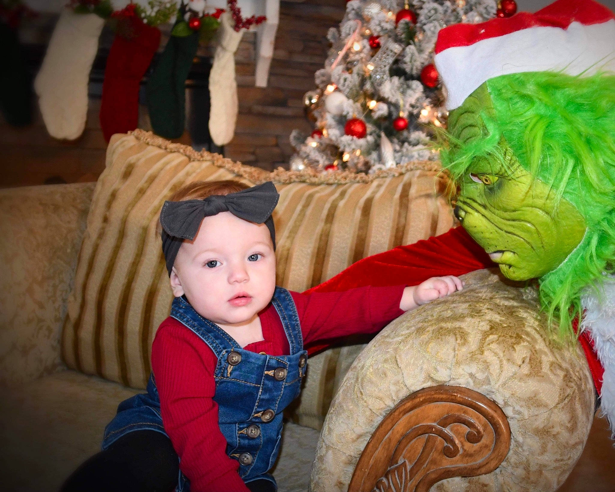 Brayleigh is registered to the contest to win money with this photo: baby_toddler_clothing, christmas, christmas_decoration, christmas_eve, christmas_ornament, comfort, costume_accessory, costume_hat, couch, event, fictional_character, fur, headwear, holiday, human, interior_design, living_room, nose, ornament, person