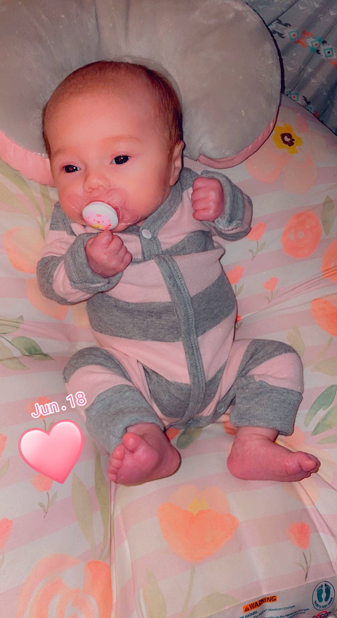 Hudson is registered to the contest to win money with this photo: art, baby, baby_products, baby_toddler_clothing, beauty, carmine, cheek, child, comfort, facial_expression, happy, linens, nose, pattern, person, petal, pink, skin, sleeve, textile