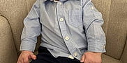 Charles participe au concours pour gagner de l'argent avec cette photo : armchair, baby, beige, blue_shirt, casual_clothing, child, closeup, comfortable, curious_expression, cute, dark_pants, happy, indoor, infant, person, portrait, sitting, smiling, tongue_out, young_child