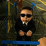 Matthias joined the competition — help win amazing prizes! child, toddler, shopping_cart, suit, sunglasses, parking_lot, grocery, person, casual_clothing, street, outdoor, yellow_lines, blue_handle, hand, toy, cute, fashion, kid, urban, funny