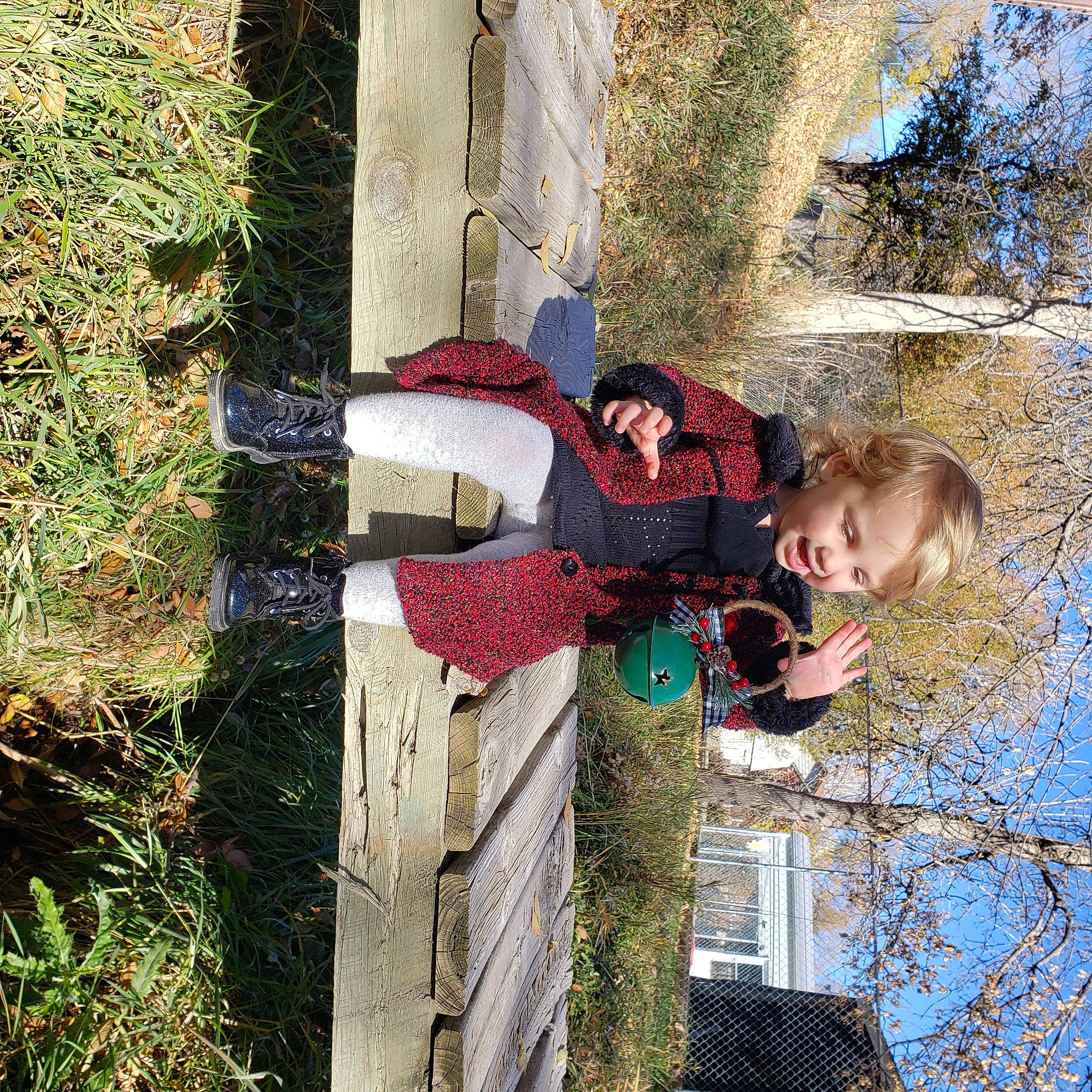 Kiya is registered to the contest to win money with this photo: building, fun, grass, leaf, leisure, pattern, people_in_nature, person, plant, sky, smile, toddler, tree, trunk, twig