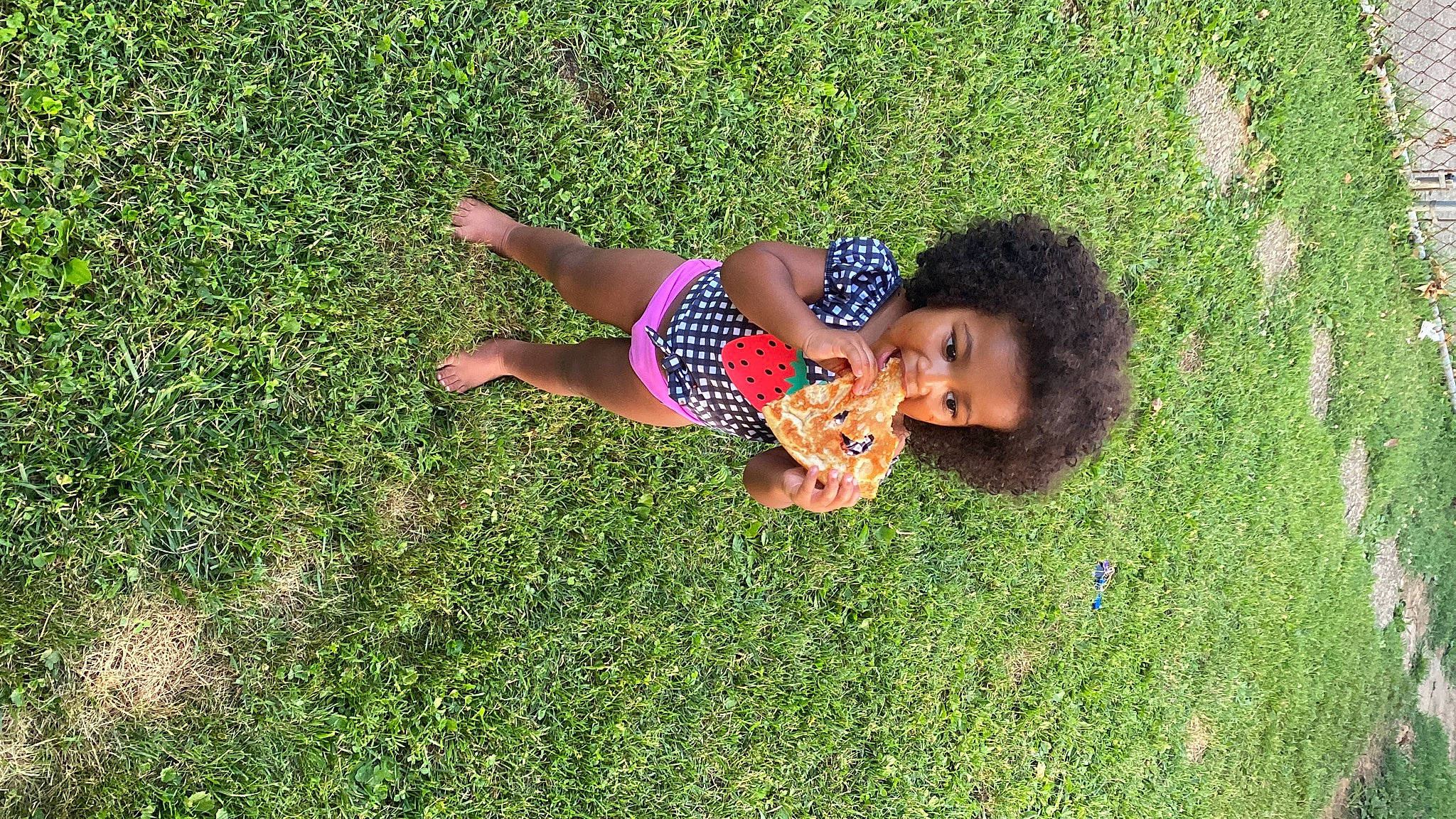 Kaida is registered to the contest to win money with this photo: dress, flooring, fun, grass, grassland, groundcover, happy, human_body, landscape, leisure, meadow, people_in_nature, person, plant, recreation, shrub, smile, sunlight, toddler, tree