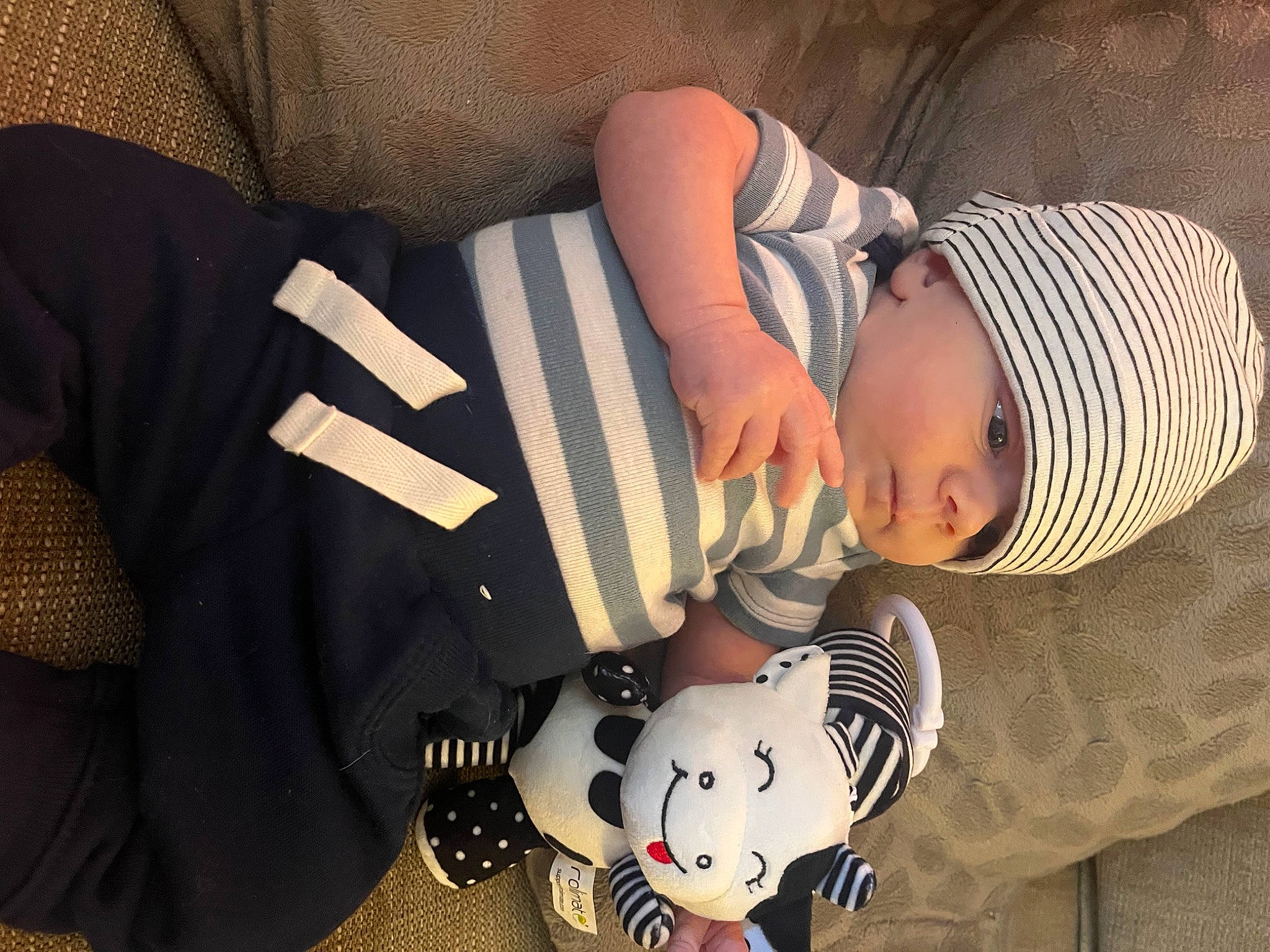 Atlas joined the competition — help win amazing prizes! baby, baby_products, baby_toddler_clothing, carmine, child, comfort, elbow, facial_expression, finger, flooring, headwear, human_body, mammal, pattern, person, room, sitting, sleeve, textile, toddler