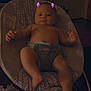baby, infant, baby_seat, digital_filter, purple_horns, indoors, child, person, naked_torso, diaper, relaxing, furniture, foot, hand, face, cute, young_child, baby_gear, home, soft_lighting