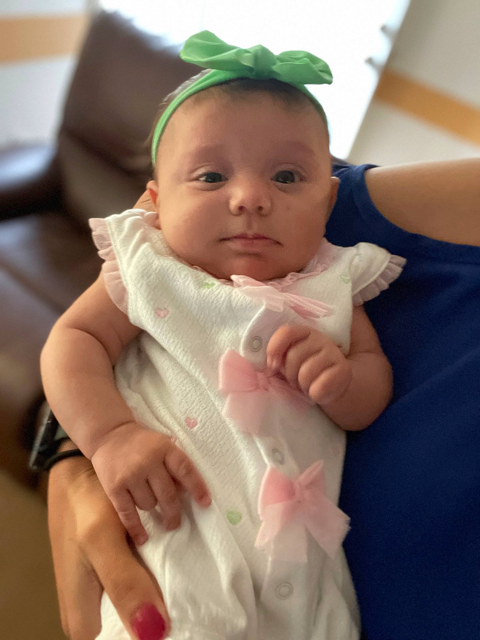 Baileigh is registered to the contest to win money with this photo: baby, baby_products, baby_toddler_clothing, cheek, child, chin, comfort, dress, eye, eyelash, finger, gesture, hand, happy, headband, nail, neck, person, skin, thumb