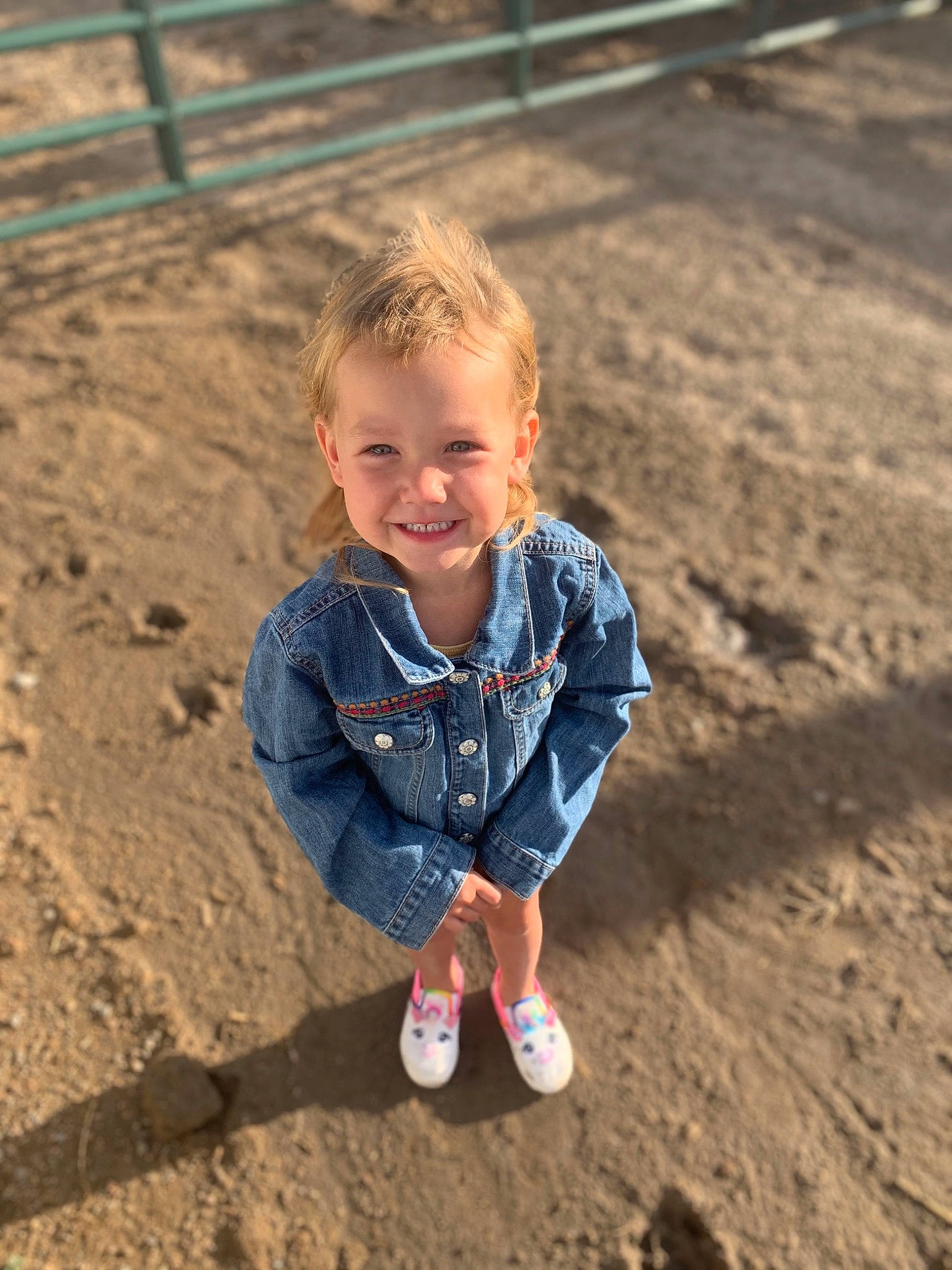Brooklynn is registered to the contest to win money with this photo: child, fun, jeans, joy, mud, person, photography, play, sand, sitting, smile, soil, toddler, vacation
