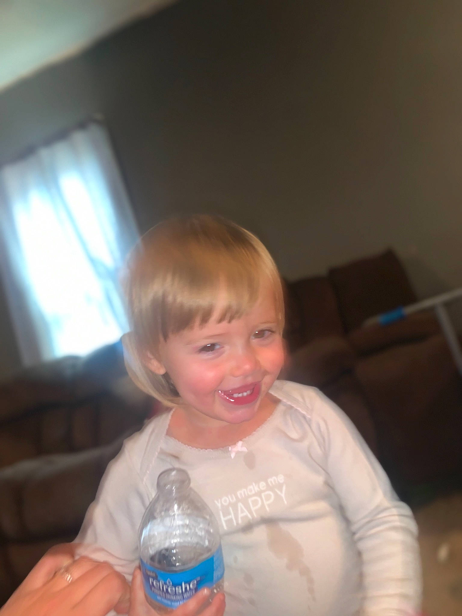Madalynn is registered to the contest to win money with this photo: baby, bottle, bottled_water, child, drink, drinking_water, drinkware, eye, facial_expression, fun, iris, joy, mouth, people, person, plastic_bottle, smile, tableware, toddler, vacation