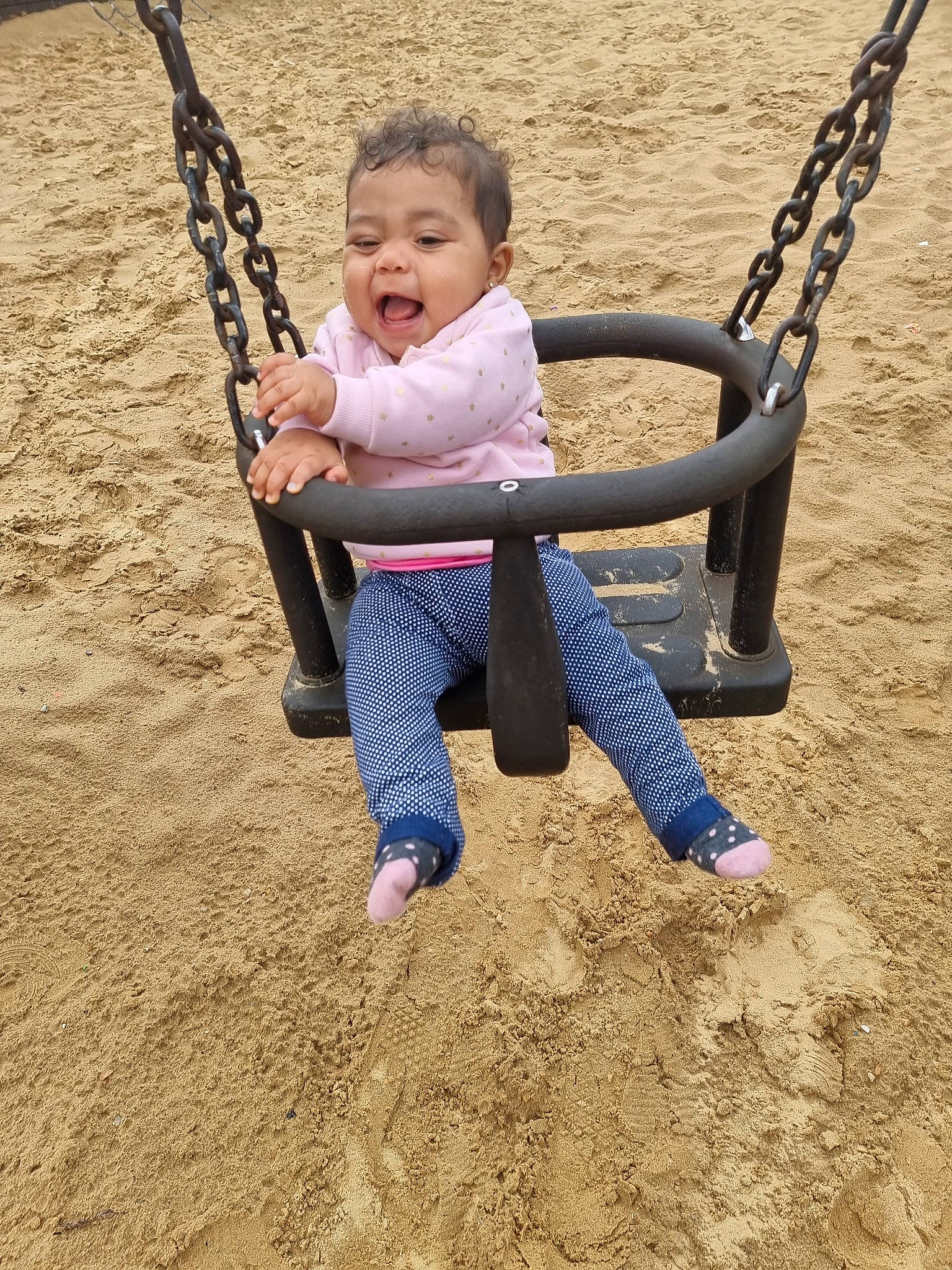 Avana Rose joined the competition — help win amazing prizes! baby, child, city, facial_expression, fun, grass, happy, leisure, outdoor_play_equipment, people_in_nature, person, play, playground, recreation, sand, sitting, sleeve, smile, swing, toddler